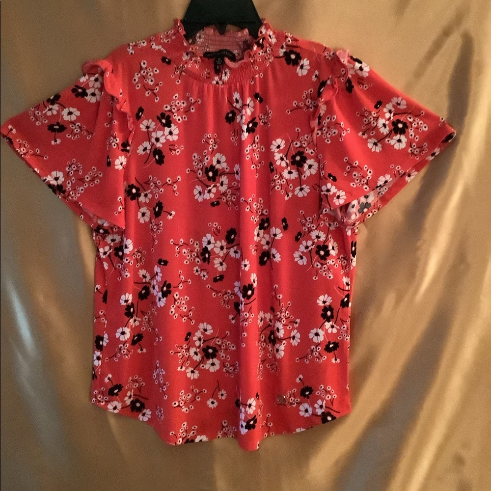 Woman’s flutter sleeve blouse